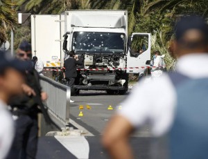 French police secure the area as the investigation continues at the scene near the heavy truck that ran into a crowd at high speed killing scores who were celebrating the Bastille Day July 14 national holiday on the Promenade des Anglais in Nice, France, July 15, 2016.    REUTERS/Eric Gaillard