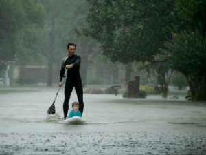 Alexendre Jourge uses evacuates Ethan Colman, 4, from a neighborhood in west Houston inundated by floodwaters from Tropical Storm Harvey on Monday, Aug. 28, 2017, in Houston, Texas. (AP Photo/Charlie Riedel)